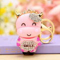 Smiling Cow Keychain with Beige Enamel and Crystal Flower Accent view 3
