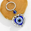 Silver Evil Eye Keychain With Butterfly Heart And Elephant Charm view 8