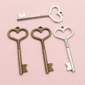 Long Heart Bow Key Pendants in Two Antique Metal Finishes view 4