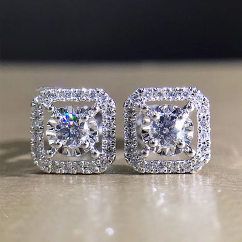 Close pair of silver square halo clear CZ stud earrings
