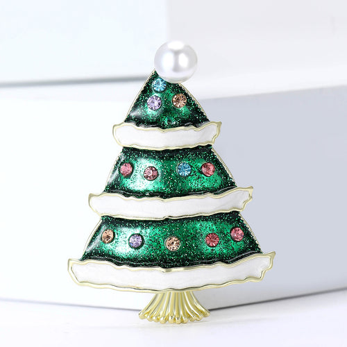 Close-up product view showing the colors and surface details of the green tiered christmas tree brooch