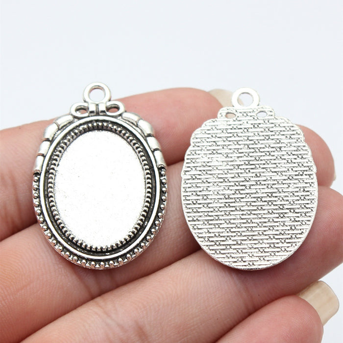Oval 18 x 25 mm Cabochon Pendant Settings in Two Finishes