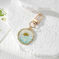 Irregular Gold Frame Dried Flower Resin Keychains Three Styles view 7