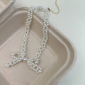 White Pearl Bow Necklace and Bracelet in Two Separate Styles view 7