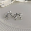 Minimal Wire Bow Stud Earrings Gold and Silver Tones view 6