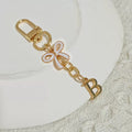 Gold Tone Initial Letter Bag Charm with Pastel Enamel Bow view 4