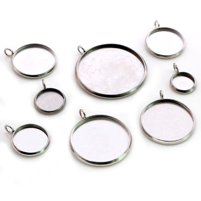Round cabochon trays arranged assortment on a white background