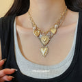 Layered Gold Tone Heart Necklace with Celestial Charms view 3