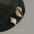 Gold Tone Conch Shell And Clear Stone Earrings In Stud And Clip Styles view 7