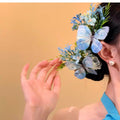Blue Fabric Butterfly Floral Spray Hair Clip Green Foliage view 3