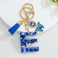 Blue Resin Alphabet Letter Keychain With Butterfly Evil Eye Charm Tassel view 9