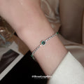 Silver Tone Clear Crystal Bracelet With Green Round Stone Accents view 4