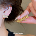 Crystal Bow Stud Earrings in Gold and Silver Tones view 2