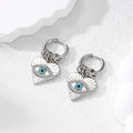 Gold and Silver Tone Multi Ring Crystal Evil Eye Huggie Earrings view 3