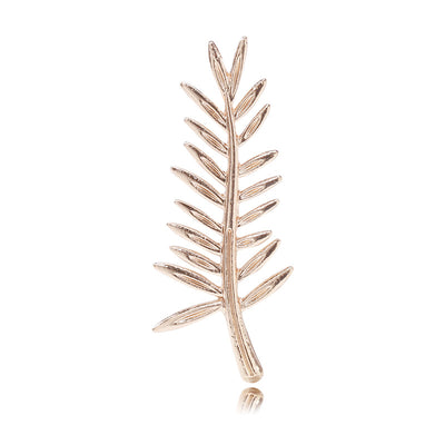Gold leaf frond brooch on white background