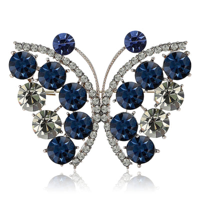 Front view of a silver-tone butterfly filled with deep blue and clear crystals
