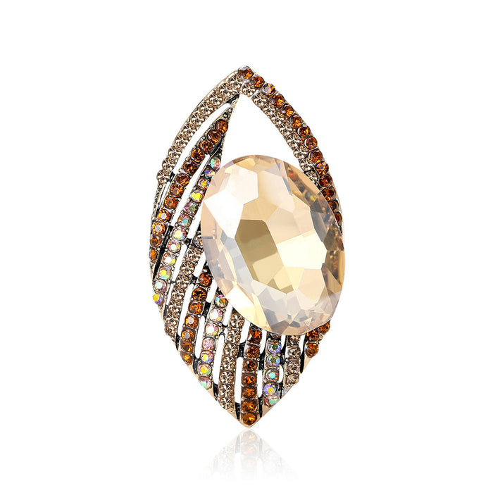 Jeweled Eye Brooch in Metal with Layered Crystal Eye with a Large Faceted Center