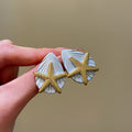 Gold Starfish And Shell Stud Earrings In Three Colors view 3