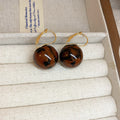 Gold Tone Hoop And Stud Earrings With Marbled Resin Ball Drops view 10