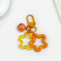 Acrylic Hollow Star Keychain With Bell And Colored Swivel Clasp Charm view 9