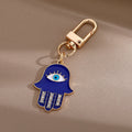 Gold and Silver Tone Crystal Hamsa Evil Eye Clip Keychains in Six Styles view 8