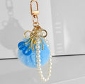 Faux Fur Pompom Charm With Pearl Beaded Strap And Bow view 6