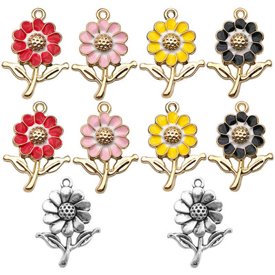 Colorful sun and sunflower charms arranged on a light background