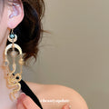 Gold Tone Sun Moon and Snake Dangle Earrings With Polished Metal Details view 3