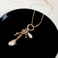 Gold Tone Layered Charm Necklaces With Decorative Accents view 7