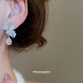 Silver Butterfly Pink Teardrop Stud Earrings with Polished Metal Details view 4
