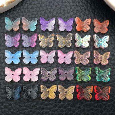 Colorful butterfly and bead beads arranged on a light background