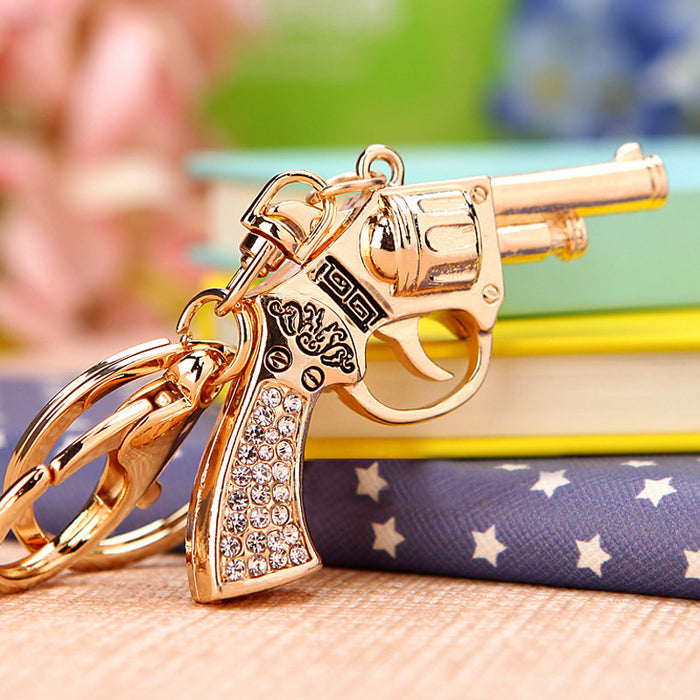 Gold Tone Revolver Keychain with Clear Crystal Grip Panels