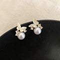 Gold Tone Butterfly Stud Earrings with White Pearl Drops view 2