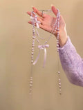 Long Pearl Tassel Necklace With Crystal Bow Accents view 8