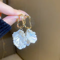 White Floral Shell and Pearl Drop Earring Collection view 7