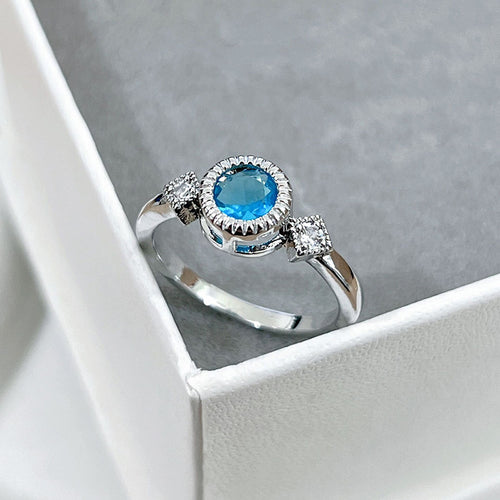 Image 2 showing blue round crystal twist band ring
