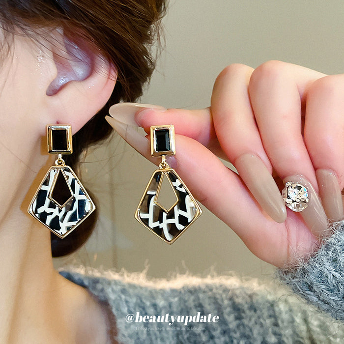 Black and White Geometric Drop Earrings with Gold Tone Frames