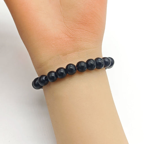 Black wood bead bracelet on wrist from another angle