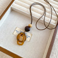 Brown Resin Geometric Pendant Cord Necklaces in Six Designs view 11