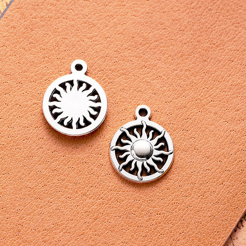 Openwork Sun Disc Metal Charm shown in front detail view