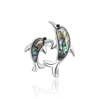 Front view of the double dolphin brooch showing two silver-tone dolphins with iridescent shell-look inlays