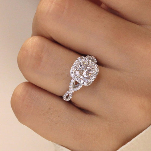 Product view showing silver-tone cushion solitaire halo infinity-band ring