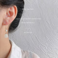 Gold Tone White Pearl And Translucent Tulip Flower Hook Earrings view 2
