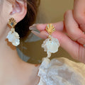 White Floral Shell and Pearl Drop Earring Collection view 12