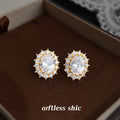 Gold Tone Clear Oval Faceted Stone Double Halo Stud Earrings view 3