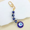 Gold-Tone Evil Eye Bead Keychain With Glass Disc Pendant view 10