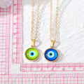 Gold Tone Small Round Evil Eye Pendant Necklaces in Seven Colors view 5