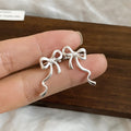 Minimal Ribbon Bow Ear Clips in Gold and Silver Tones view 6