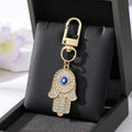Gold and Silver Tone Crystal Hamsa Hand Evil Eye Clip Keychains in Ten Designs view 11