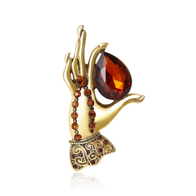 Jeweled Hand Brooch shown alone on a light background